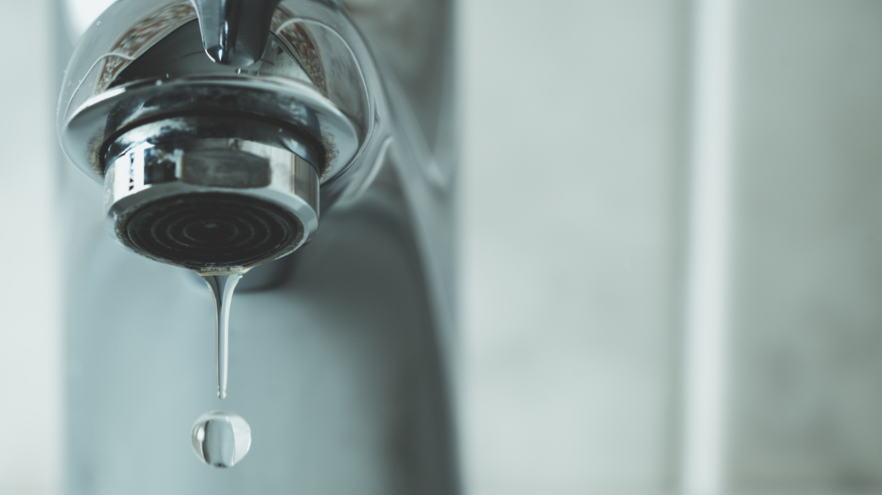 Close up of dripping silver tap
