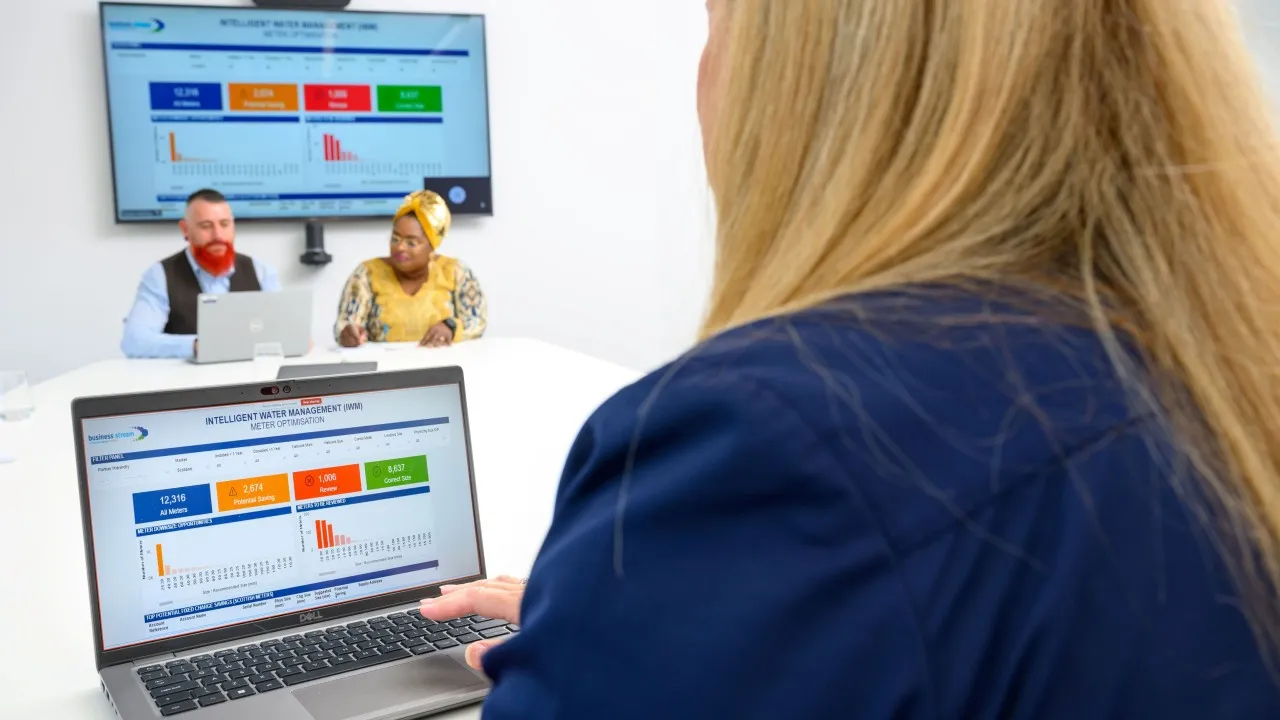 Person viewing data dashboard in meeting room