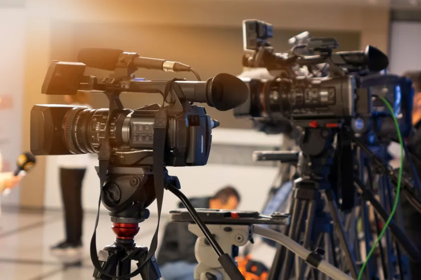 Media cameras at a press conference