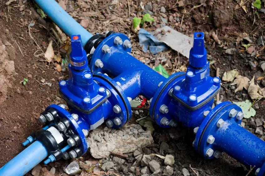 Blue pipe connection junction in the ground