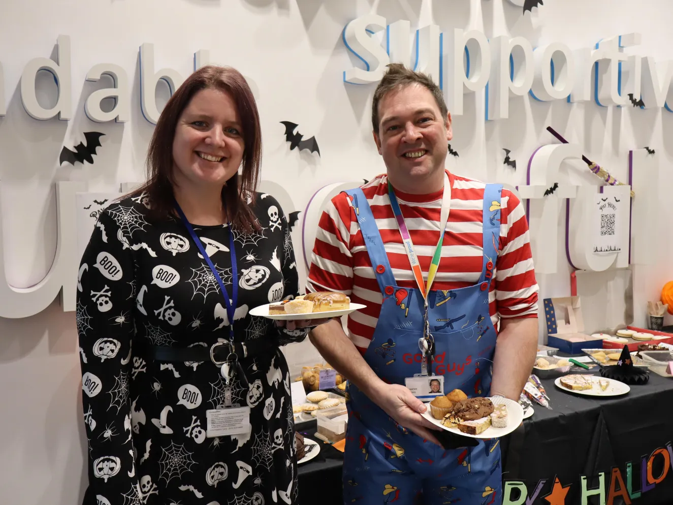 Two people at Halloween bake sale