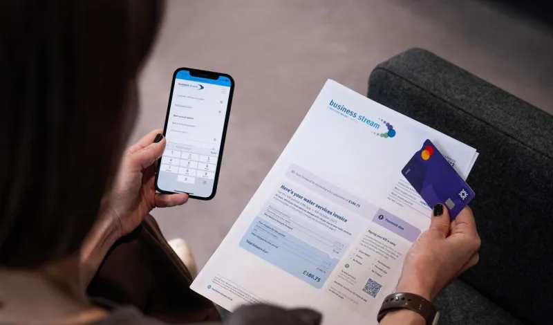 Woman paying a bill on her phone