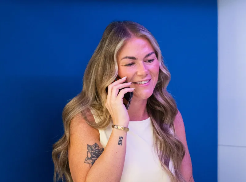 Woman speaking on the phone and smiling